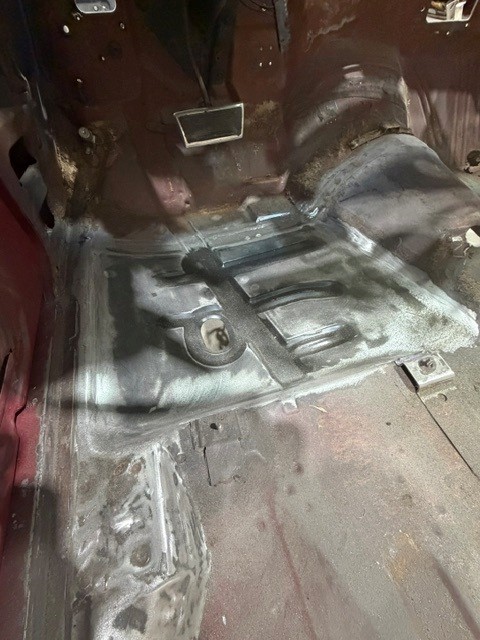Freshly welded replacement floor pan inside a classic GTO body shell