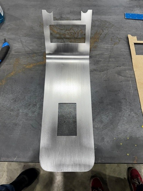 Hand-formed brushed aluminum center console panel for a Thunderbird