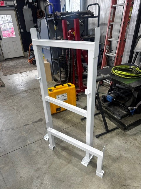 White painted steel ladder rack fabricated in the shop